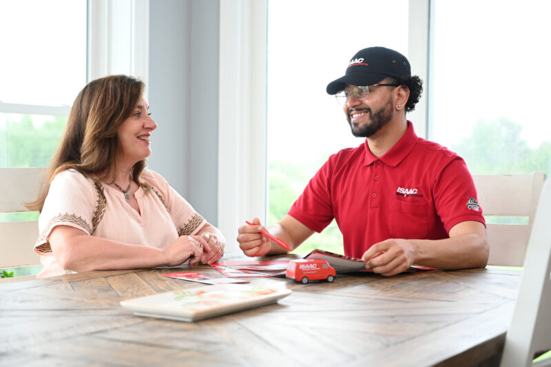 Isaac employee speaking with a homeowner