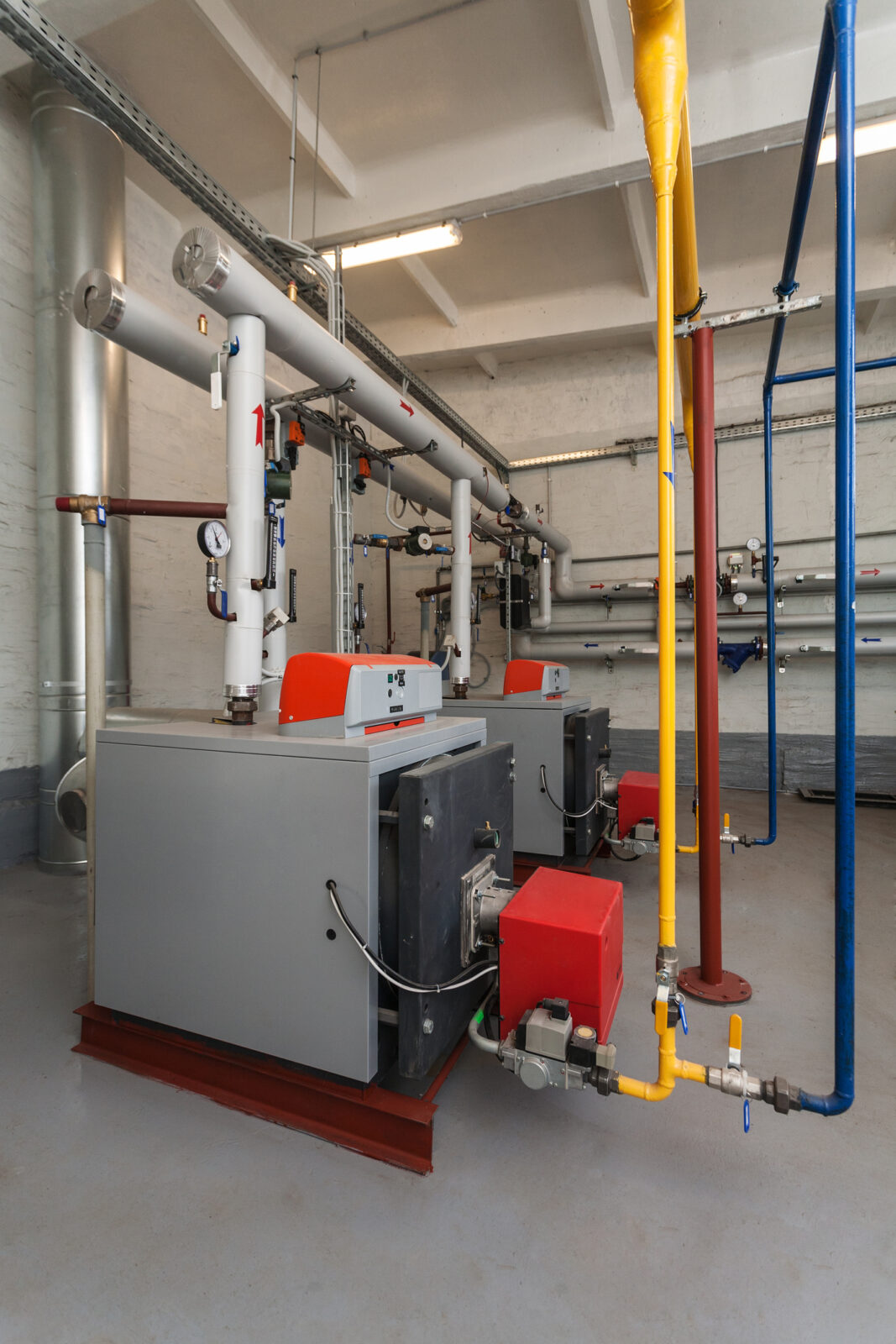 Gas boilers in a commercial boiler room